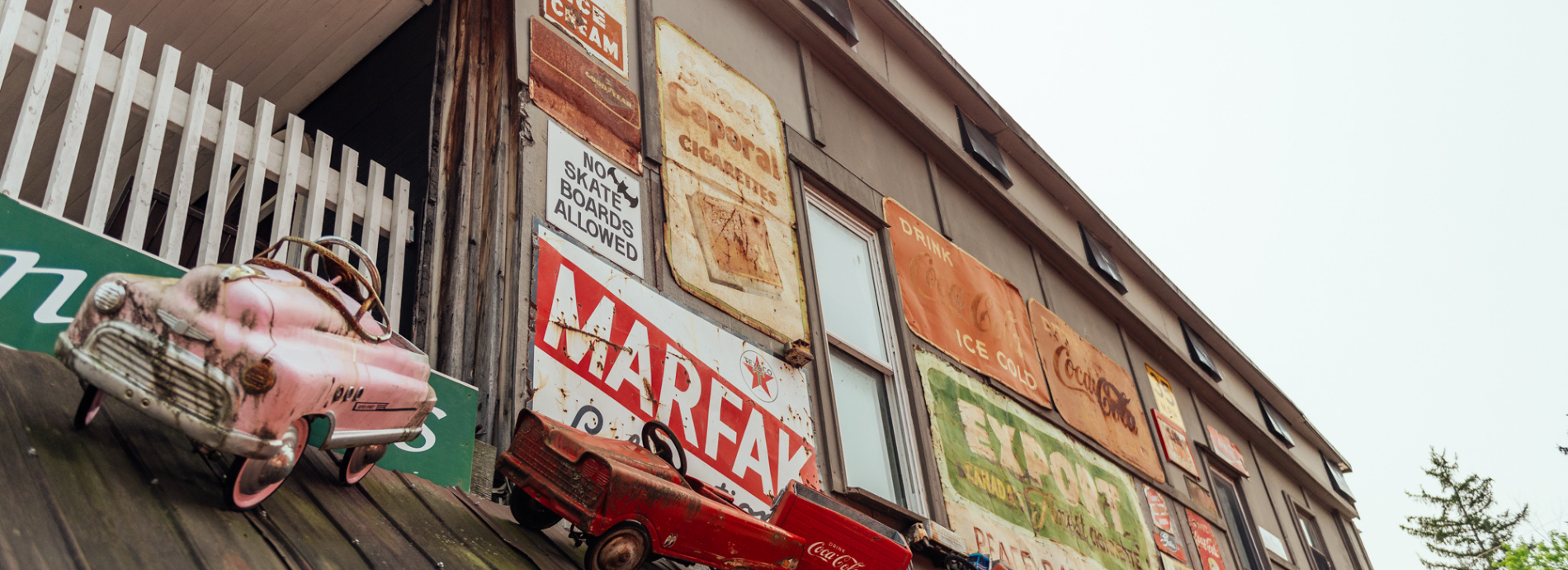 display of metal signs on the side of a building