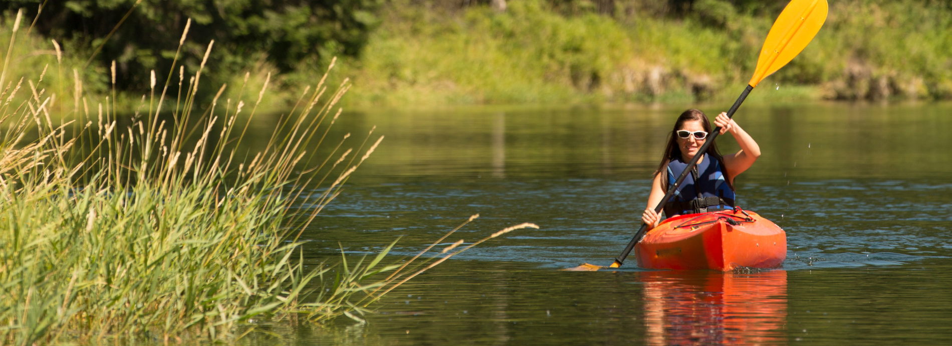 female paddler on a river