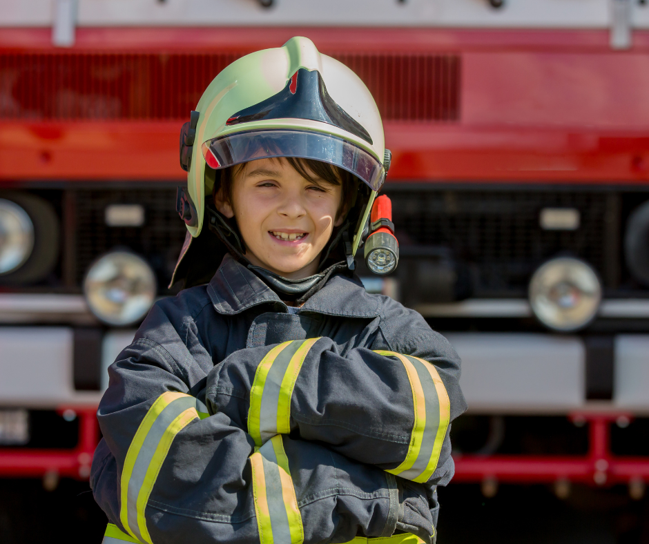 young child dressed as a firefighter