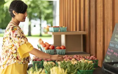 woman shopping at an outdoor food market