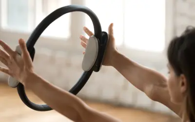 individual holding Pilates ring