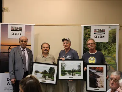 Left to right: Mayor Mike Burkett and Good Neighbour Award recipients Brian Emery, Herb Roy, and Randy Kincaide, 